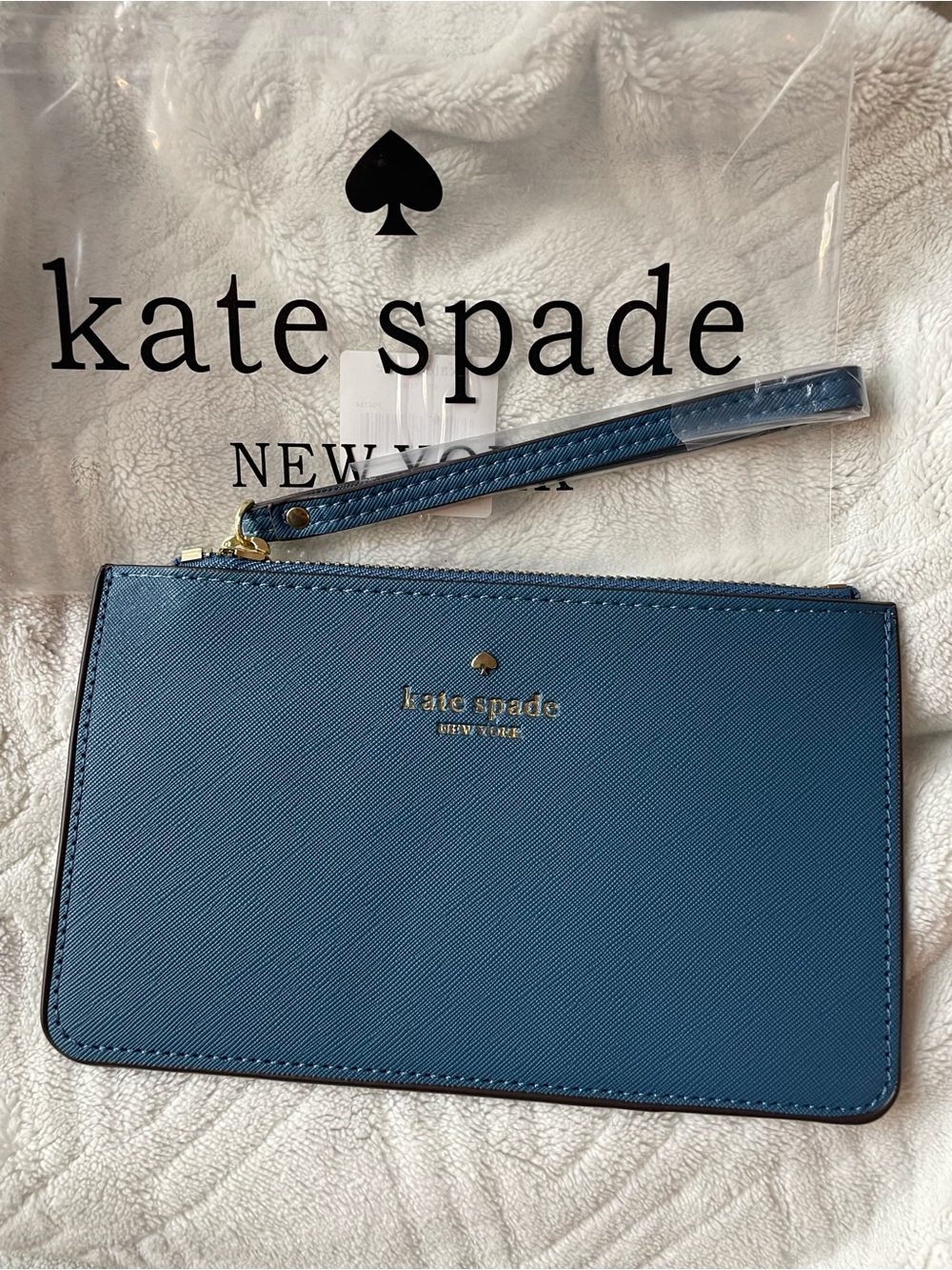 kate spade blue saffiano wristlet pouch with gold logo